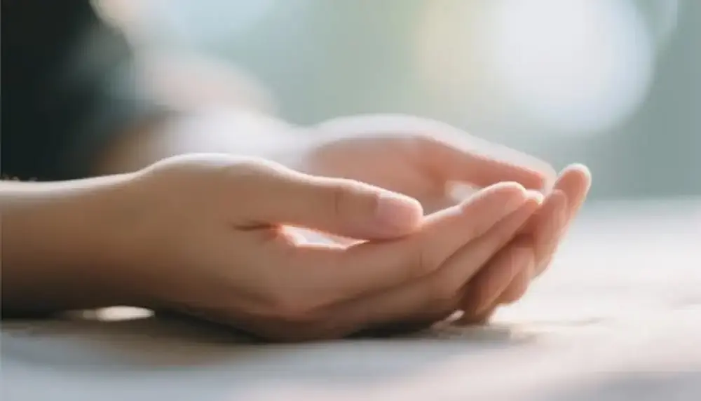 Hands resting calmly to symbolize stress reduction and mindfulness